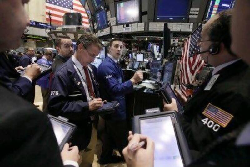 Stocks surged after central banks agreed a coordinated effort to boost liquidity in a bid to prop up the global financial system. Richard Drew / AP Photo