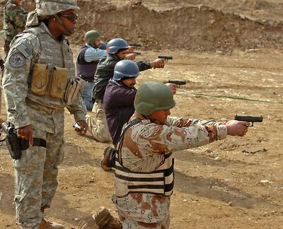 A US officer trains Iraqi policemen at a Mosul firing range on February 17 last year. Iraq's current government believes its security forces are now in a strong position to defend the country against terrorism. Courtesy: US Army