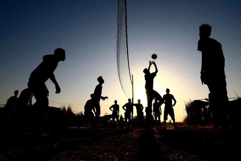 Ethiopian refugees who fled fighting in Tigray province play volleyball at the Um Rakuba camp in Sudan's eastern Gedaref province.  AFP