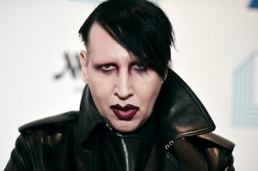 FILE - Marilyn Manson attends the 9th annual "Home for the Holidays" benefit concert in Los Angeles, on Dec.  10, 2019.  Authorities searched the home of the rocker on Monday, Nov.  29, 2021, after allegations of physical and sexual abuse by several women.   (Photo by Richard Shotwell / Invision / AP, File)
