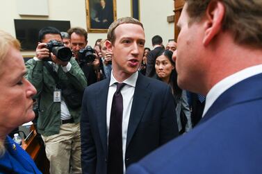 Facebook chairman and chief executive Mark Zuckerberg greets members of congress after testifying at a House Financial Services Committee hearing in Washington. Reuters