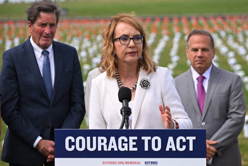 Gabby Giffords, a former Democratic US representative, speaks during the opening of the Gun Violence Memorial on the National Mall in Washington on Tuesday. Ms Giffords was shot at a political rally in Tucson, Arizona, in 2011.  AFP