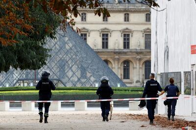 French police officers patrol in front of the Louvre museum, which was closed for security reasons on Saturday. Reuters 