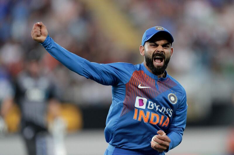 India’s captain Virat Kohli reacts after catching New Zealand’s Martin Guptill during the second Twenty20 cricket match between New Zealand and India at Eden Park in Auckland on January 26, 2020.  / AFP / DAVID ROWLAND
