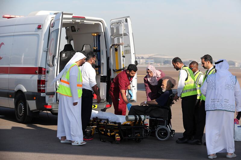 A Palestinian patient prepares to board an ambulance