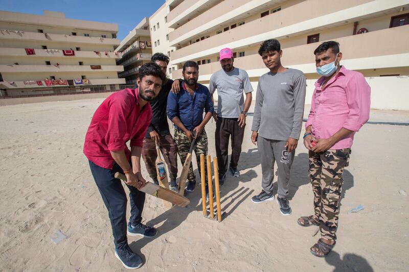 Labourers outside their accommodation in Jebel Ali Industrial area.  Ruel Pableo / The National