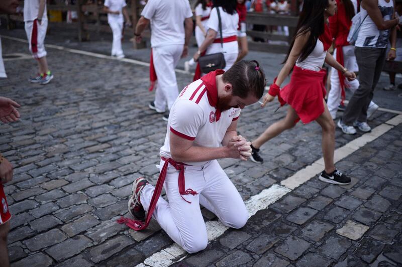 A runner prays before the event. Vincent West / Reuters
