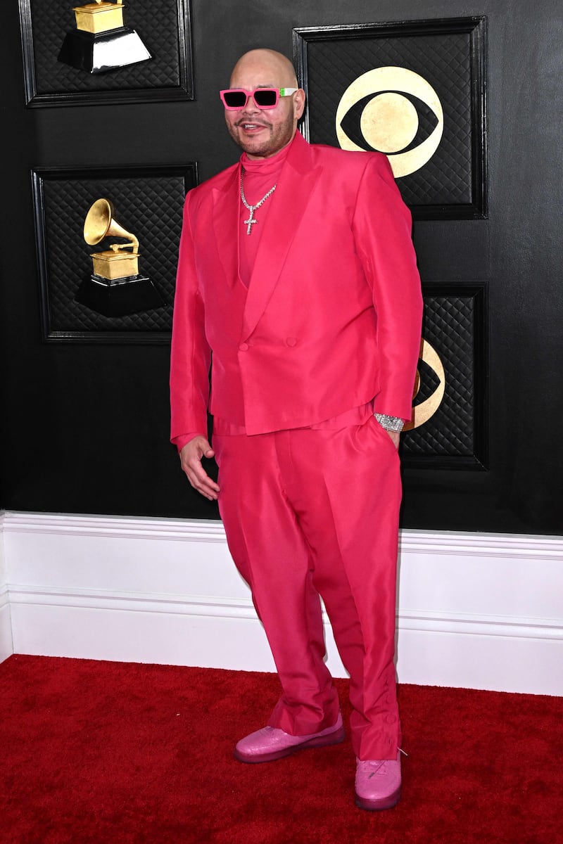 US rapper Fat Joe wears a coral suit paired with pink shoes and sunglasses. AFP