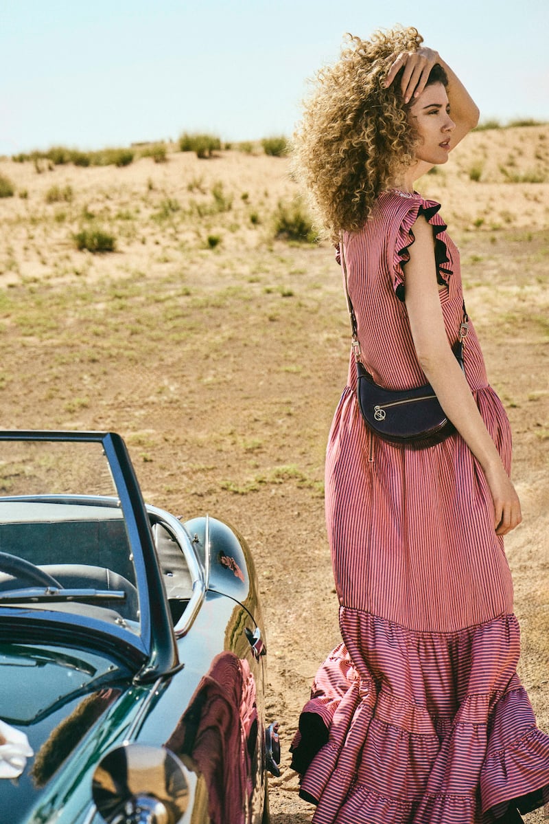 Dress, Dh35,000; and Loop bag, Dh11,100, both from Louis Vuitton
