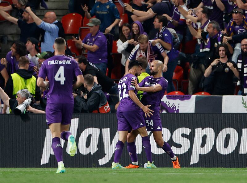 Fiorentina's Nicolas Gonzalez and Sofyan Amrabat celebrate their equalising goal scored by Giacomo Bonaventura. Reuters