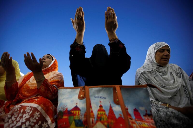 Shia Muslim women pray during the death anniversary of Ali, son-in-law of Prophet Mohammad, at Hazratbal shrine during the holy month of Ramadan in Srinagar. Danish Ismail / Reuters