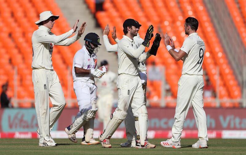 Veteran seamer James Anderson celebrates with Ben Foakes after taking the wicket of Rishabh Pant. Getty