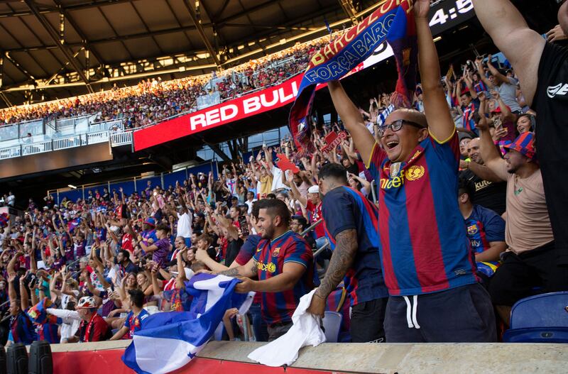Barcelona fans cheer on their team inside the Red Bull Arena. AFP