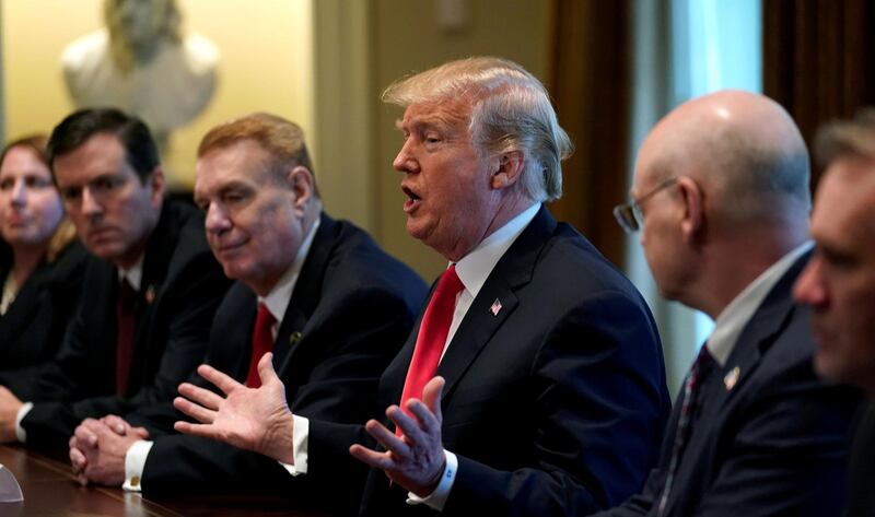 FILE PHOTO: U.S. President Donald Trump announces that the United States will impose tariffs of 25 percent on steel imports and 10 percent on imported aluminum during a meeting at the White House in Washington, U.S., March 1, 2018. REUTERS/Kevin Lamarque/File Photo