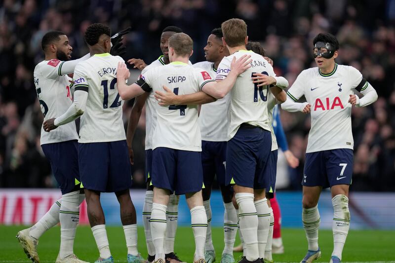 Tottenham players celebrate after teammate Harry Kane, second right, scored his side's opening goal during the English FA Cup soccer match between Tottenham Hotspur and Portsmouth at Tottenham Hotspur Stadium in London, Saturday, Jan.  7, 2023.  (AP Photo / Kin Cheung)