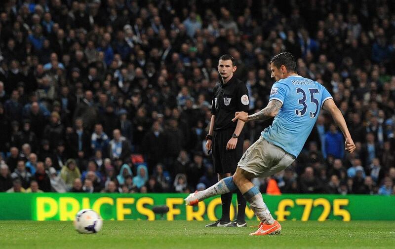 Stevan Jovetic of Manchester City scores the third goal against Aston Villa on Wednesday. Peter Powell / EPA / May 7, 2014