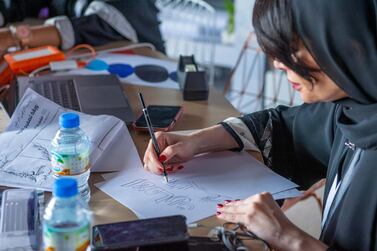 One of the 49 Emirati artists sketches an idea for a logo. Courtesy Ministry of Cabinet Affairs and The Future