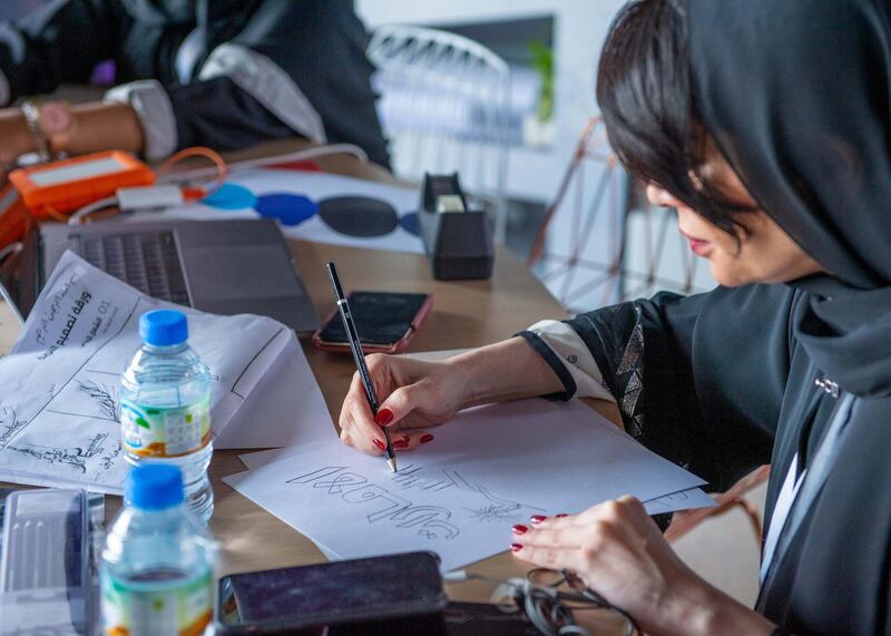 One of the 49 Emirati artists sketches an idea for a logo. Courtesy Ministry of Cabinet Affairs and The Future