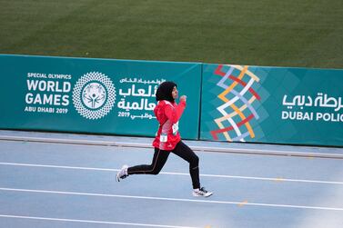 Hamda Al Hosani wins first place in the 200 metre sprint at the Special Olympics World Games Abu Dhabi 2019 at the Dubai Police Academy Stadium. Reem Mohammed / The National