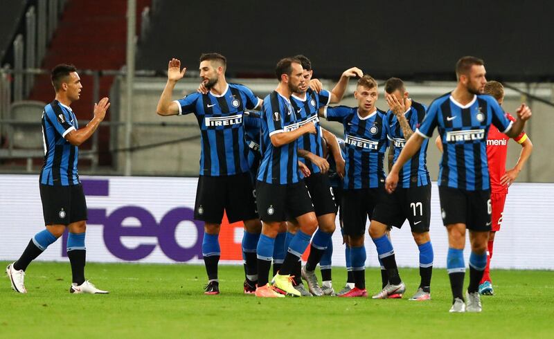Inter Milan's Nicolo Barella, third right, celebrates with his teammates after scoring. PA