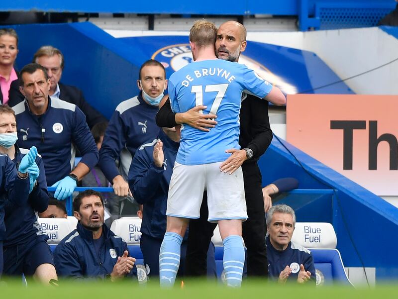 Manchester City's Kevin De Bruyne hugs manager Pep Guardiola. Reuters