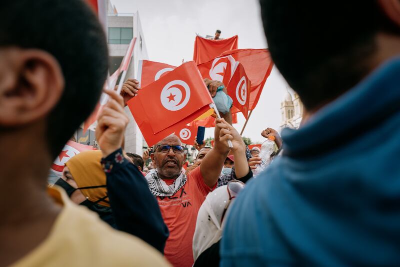 People take to the streets in Tunis to protest against the rule of President Kais Saied, who now faces defiance from the Tunisian Parliament. Erin Clare Brown / The National