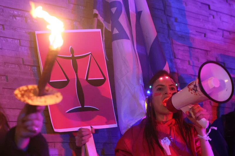 Israeli protesters attend a rally in central Tel Aviv. AFP