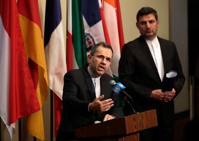 epa07671472 Iran's ambassador to the United Nations Majid Takht-Ravanchi (L) addresses the media at the Security Council stakeout area before the start of the UN Security Council meeting on the situation in Iran at United Nations Headquarters in New York, New York, USA, 24 June 2019.  EPA/JASON SZENES