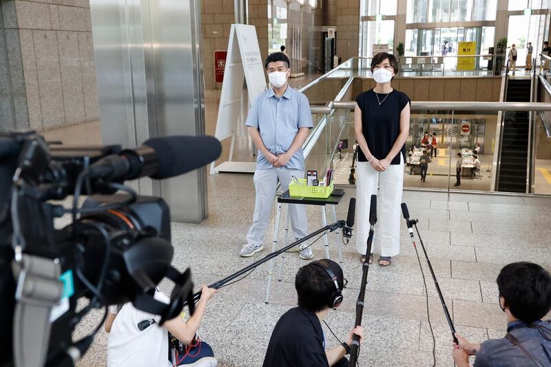 Japanese recipients of the Moderna coronavirus vaccine talk to the press at the Tokyo Metropolitan Government building. Despite a slow start, Japan's vaccination efforts have increased and about 11 million people are fully vaccinated. Japan has pledged a million vaccines each to Taiwan and Vietnam. Getty