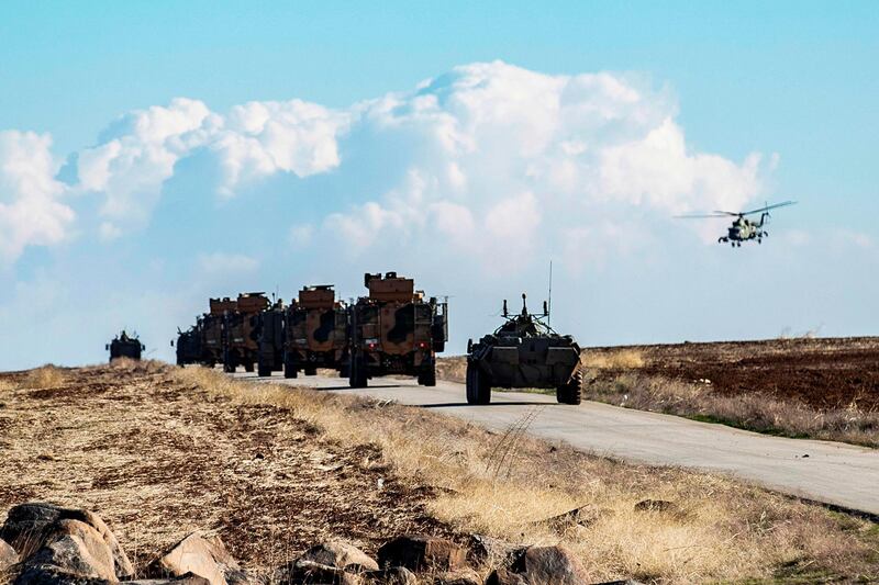 A joint Russian-Turkish patrol advances in the countryside of the Syrian town of al-Jawadiyah, in the northeastern Hasakeh province, near the border with Turkey, on December 24, 2020.  / AFP / Delil SOULEIMAN
