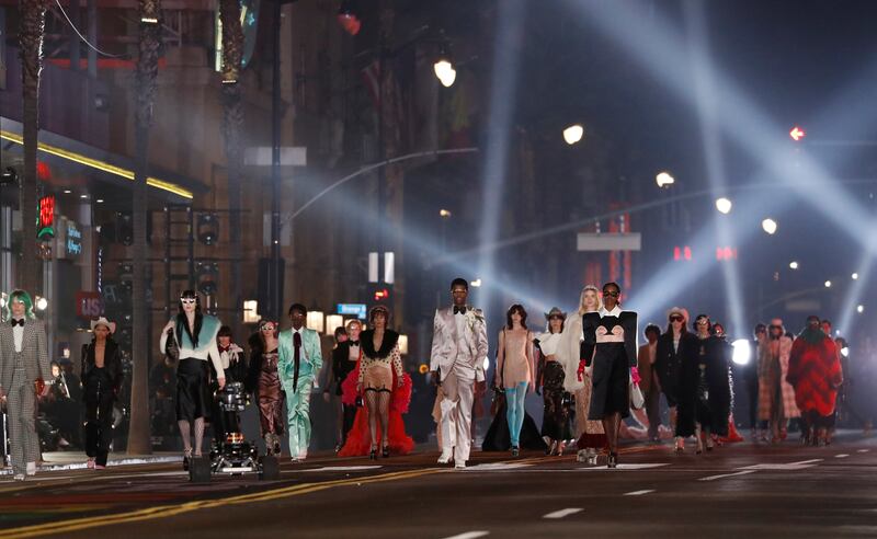 Models walk on Hollywood Blvd at the conclusion of the Gucci Love Parade fashion show in Los Angeles, California, U. S. , November 2, 2021.    REUTERS / Mario Anzuoni