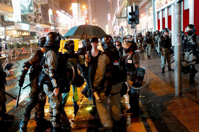 Riot police detain a protester during an anti-government rally in central Hong Kong. Reuters