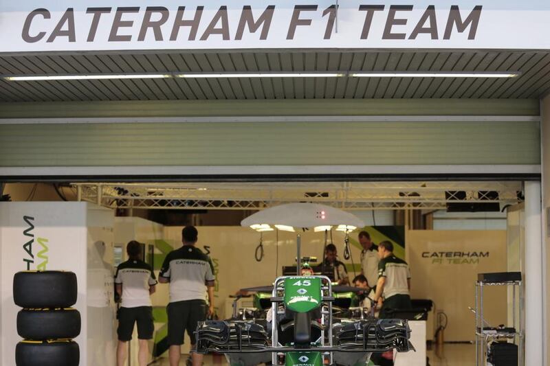 The Caterham F1 team shown working at Yas Marina Circuit during the Abu Dhabi Grand Prix. Caren Firouz / Reuters / November 20, 2014