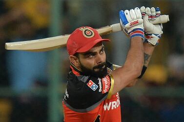 (FILES) In this file photo taken on May 01, 2019 Royal Challengers Bangalore captain Virat Kohli plays a shot during the 2019 Indian Premier League (IPL) Twenty20 cricket match between Royal Challengers Bangalore and Rajasthan Royals at The M. Chinnaswamy Stadium in Bangalore. Kohli says he has never felt so "calm" going into an Indian Premier League season as the Royal Challengers Bangalore skipper chases an elusive title in the Twenty20 tournament, starting September 19, 2020, in the United Arab Emirates. - ----IMAGE RESTRICTED TO EDITORIAL USE - STRICTLY NO COMMERCIAL USE----- / GETTYOUT / AFP / Manjunath KIRAN / ----IMAGE RESTRICTED TO EDITORIAL USE - STRICTLY NO COMMERCIAL USE----- / GETTYOUT