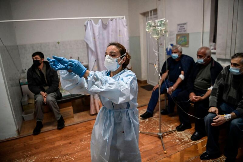 A medical staff member gives treatment to patients in a hospital of the city of Stepanakert, during the ongoing fighting between Armenian and Azerbaijani forces over the breakaway region of Nagorno-Karabakh. AFP