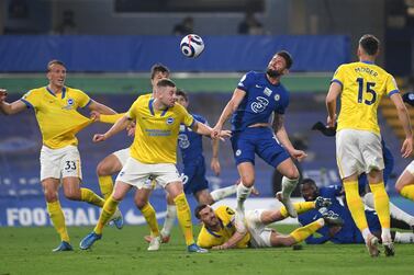 Olivier Giroud of Chelsea and Adam Webster of Brighton & Hove Albion battle for the ball during the Premier League match between Chelsea and Brighton & Hove Albion at Stamford Bridge on April 20, 2021 in London, England. Getty Images