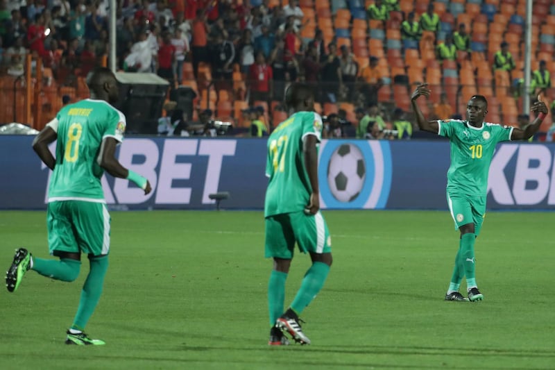 Senegal's Sadio Mane, right, gestures in frustration. AP