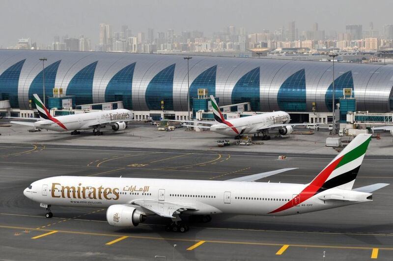 An Emirates plane taxis to a gate at Dubai International Airport (DXB), Dubai's biggest airport, which recorded 4.5 per cent year-on-year growth in passenger numbers in March, according to operator Dubai Airports. Adam Schreck / AP