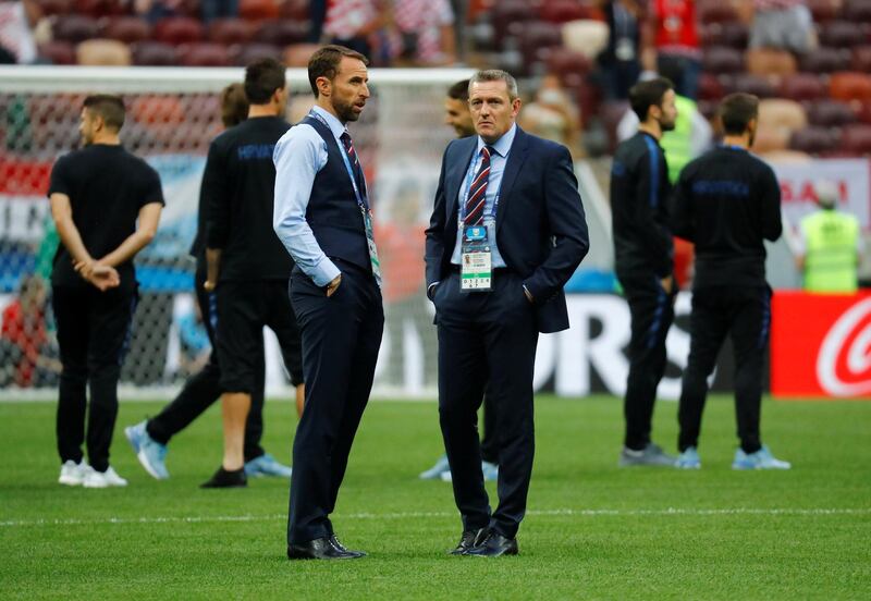 England manager Gareth Southgate with England U21 manager Aidy Boothroyd on the pitch before the match. Reuters