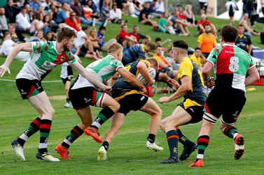 Abu Dhabi Harlequins, in green, red and white, will face Jebel Ali Dragons in the UAE Premiership final. Satish Kumar for The National 