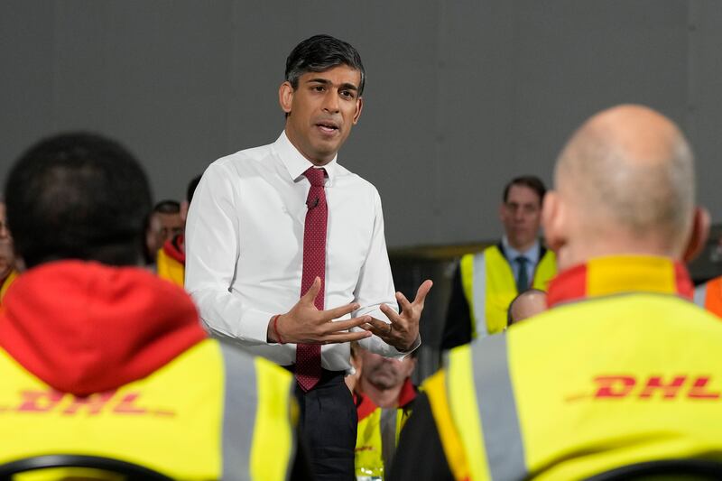 Prime Minister Rishi Sunak visits a DHL depot in Essex, where he told workers he was concerned by the rise in younger people 'trapped on benefits'. Getty Images