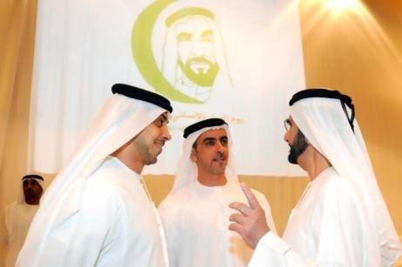 Sheikh Mohammed bin Rashid, the Prime Minister and Ruler of Dubai, right, with Sheikh Mansour bin Zayed, Minister of Presidential Affairs, and Sheikh Saif bin Zayed, Deputy Prime Minister and Minister of Interior, at last night's launch in Dubai of Zayed Day for Humanitarian Work. Wam