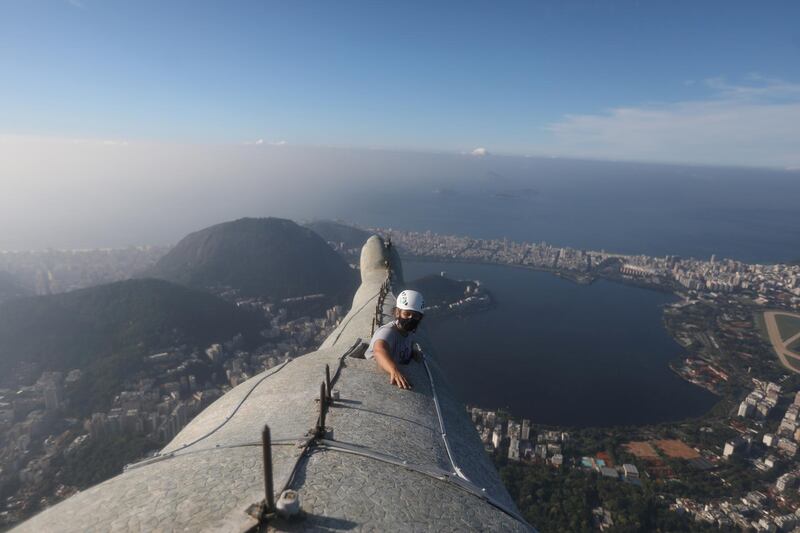 Architect Cristina Ventura, who is in charge of the Christ the Redeemer statue restoration, checks the statue's arm. Work is under way ahead of the statue's 90th anniversary this year in Rio de Janeiro, Brazil. Reuters