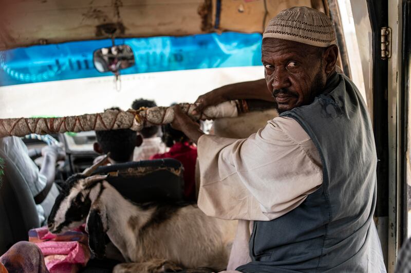 Mohamed, 60, from Eritrea, rides on a bus with a goat to Shagarab refugee camp during the rainy season. More than 50,000 people have poured into Sudan since violence broke out between Ethiopian forces and the Tigray Peoples' Liberation Front in 2020. Getty