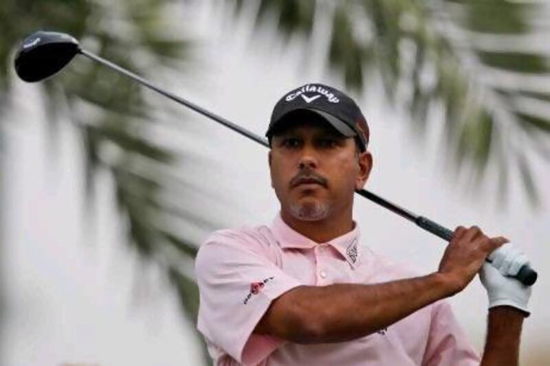 India's Jeev Milkha Singh plays a ball on the 16th hole during the 1st round of Dubai Desert Classic golf tournament in Dubai, United Arab Emirates, Thursday, Feb. 4, 2010. (AP Photo/Kamran Jebreili) *** Local Caption *** XKJ120_Emirates_Dubai_Desert_Classic_Golf.jpg