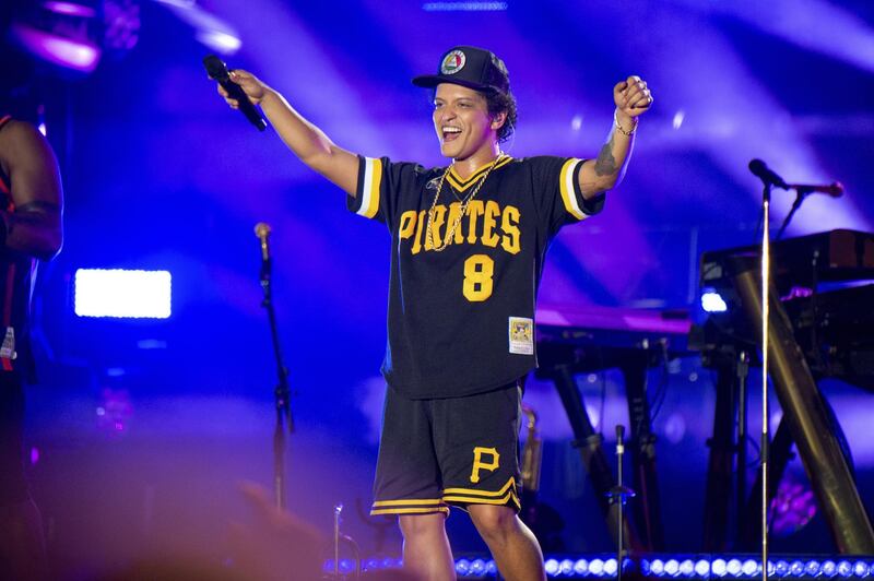 FILE - In this May 27, 2018 file photo, Bruno Mars performs at the Bottle Rock Napa Valley Music Festival at Napa Valley Expo in Napa, Calif. Cardi B may have backed out of the Bruno Mars tour, but he's found four other acts to hit the road with him. Mars announced Tuesday, Aug. 14, 2018, that Boyz II Men, Charlie Wilson, Ciara and "Boo'd Up" singer Ella Mai will perform during his upcoming fall concerts on his 24K Magic World Tour. (Photo by Amy Harris/Invision/AP, File)