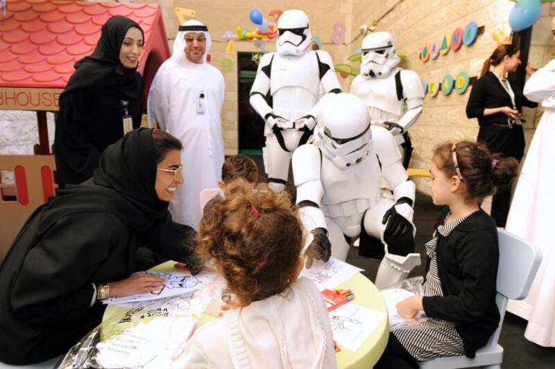 Twofour54 CEO Noura Al Kaabi and three Star Wars Stormtroopers paid a visit to children at Sheikh Khalifa Medical City in Abu Dhabi. Courtesy of twofour54  *** Local Caption ***  al99-S&H-stormtroopers02.jpg