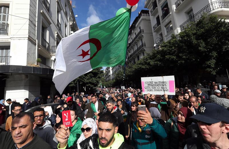epa08059455 Algerians chant slogans as they march during an anti-government demonstration in Algiers, Algerian, 10 December 2019. The demonstration is against the upcoming presidential election scheduled for 12 December.  EPA/MOHAMED MESSARA