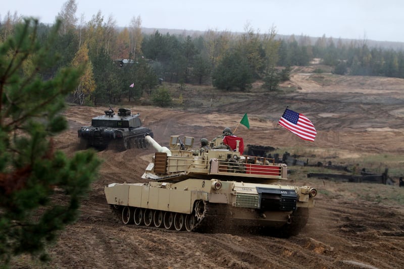 US soldiers operating an Abrams tank participate in a military exercise with UK soldiers in Latvia in 2018. EPA