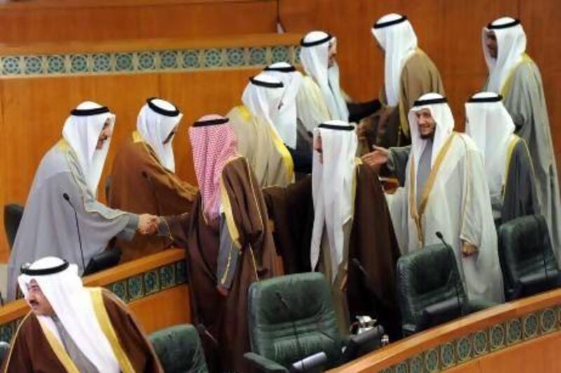 Kuwaiti Ministers (right) welcome new Members of Parliament at the opening of the parliament in Kuwait city.